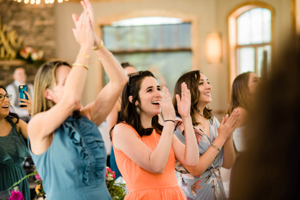 Wedding guests clapping.