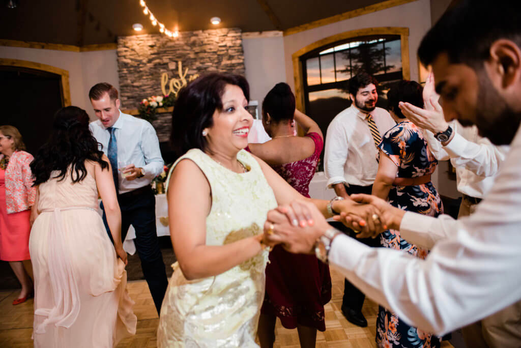 A packed dance floor at a wedding.