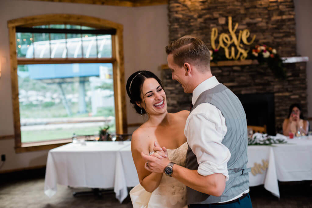 A first dance between a young bride and groom.